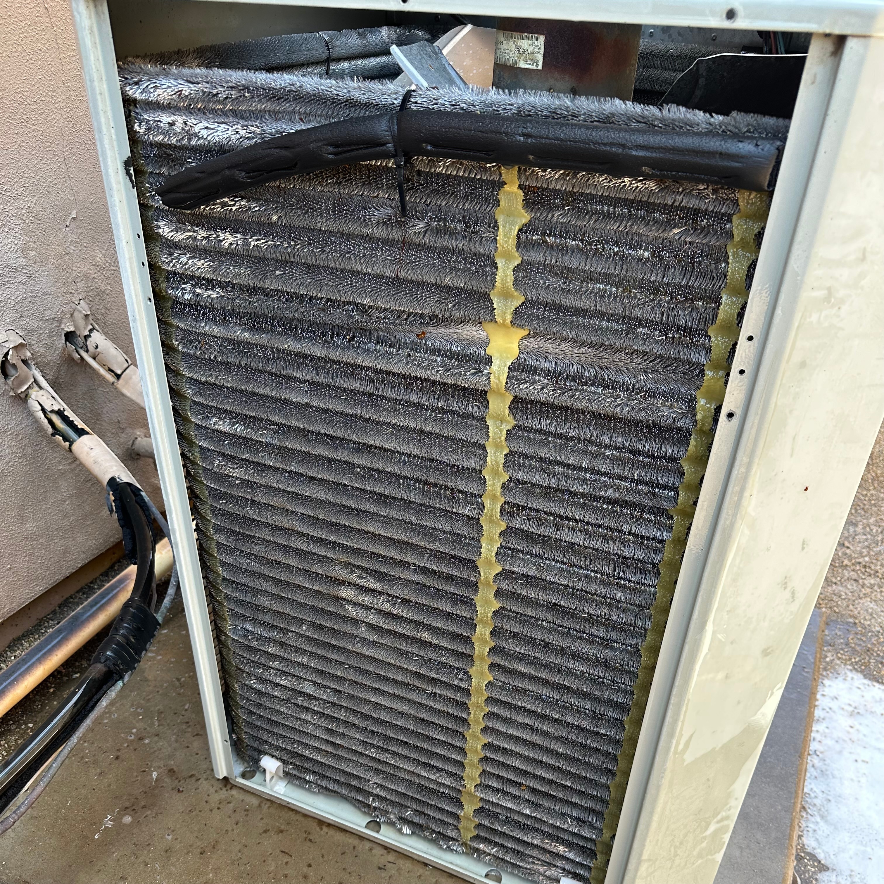 A sparkling clean HVAC condenser coil after being washed.
